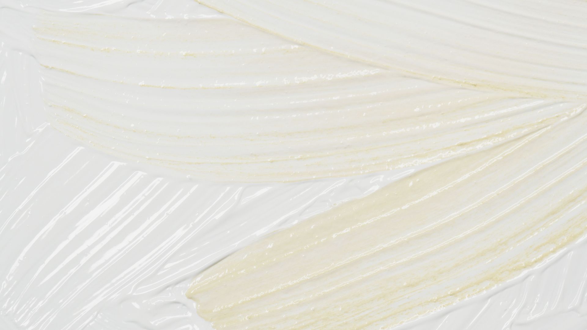 Abstract white and pale gold feather-like texture with soft curved lines