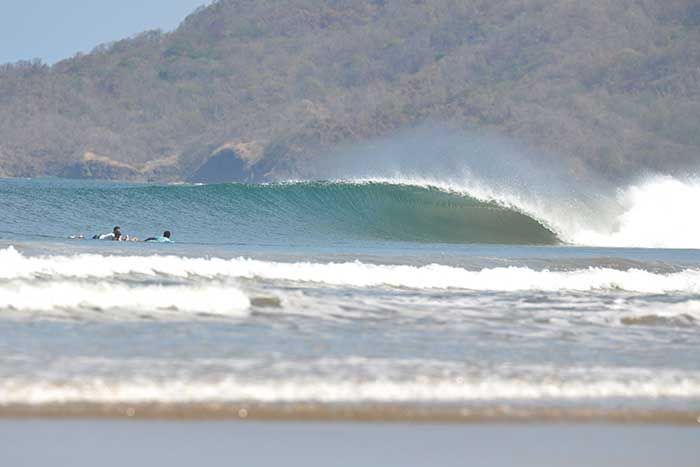 Empty wave breaking at the Tamarindo Rivermouth