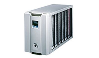 White, rectangular Trion whole-house air cleaner unit with vertical pleated filter panels on the side.