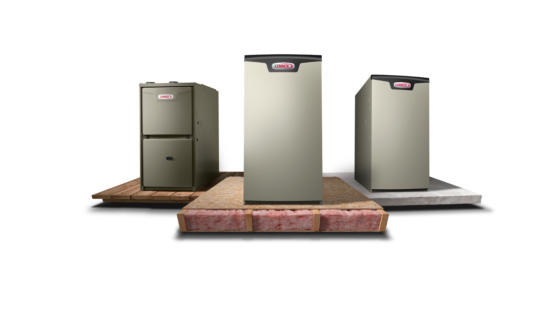 Three gray HVAC furnace units standing on individual platforms with insulation visible beneath them.