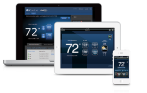 Three devices—a laptop, tablet, and smartphone—displaying a smart thermostat app interface with a temperature of 72 degrees.