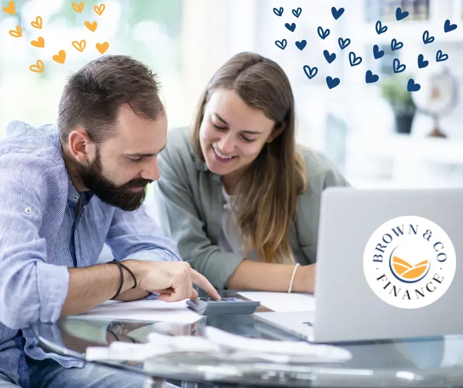 Two People Sitting at a Desk — Brown & Co Finance in Miles, QLD