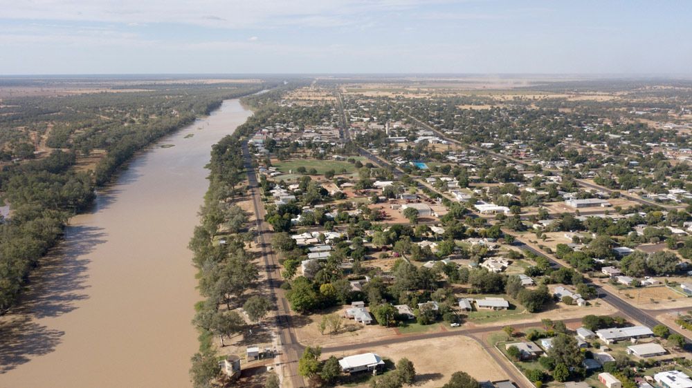 An Aerial View Of A City Surrounded By Trees And A River — Brown & Co Finance in St George, QLD