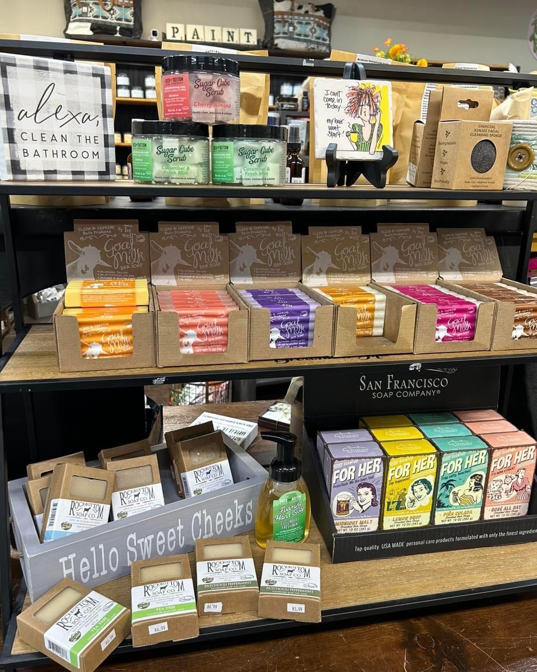 A store shelf filled with lots of soaps and candles.