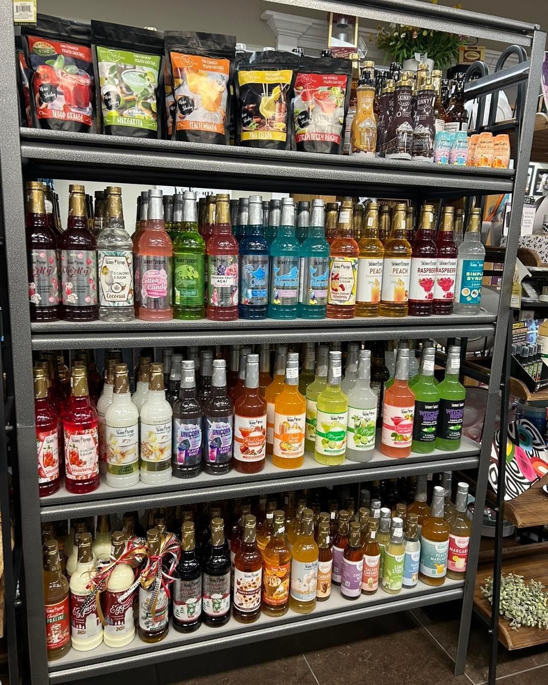 A shelf filled with lots of bottles of liquor.