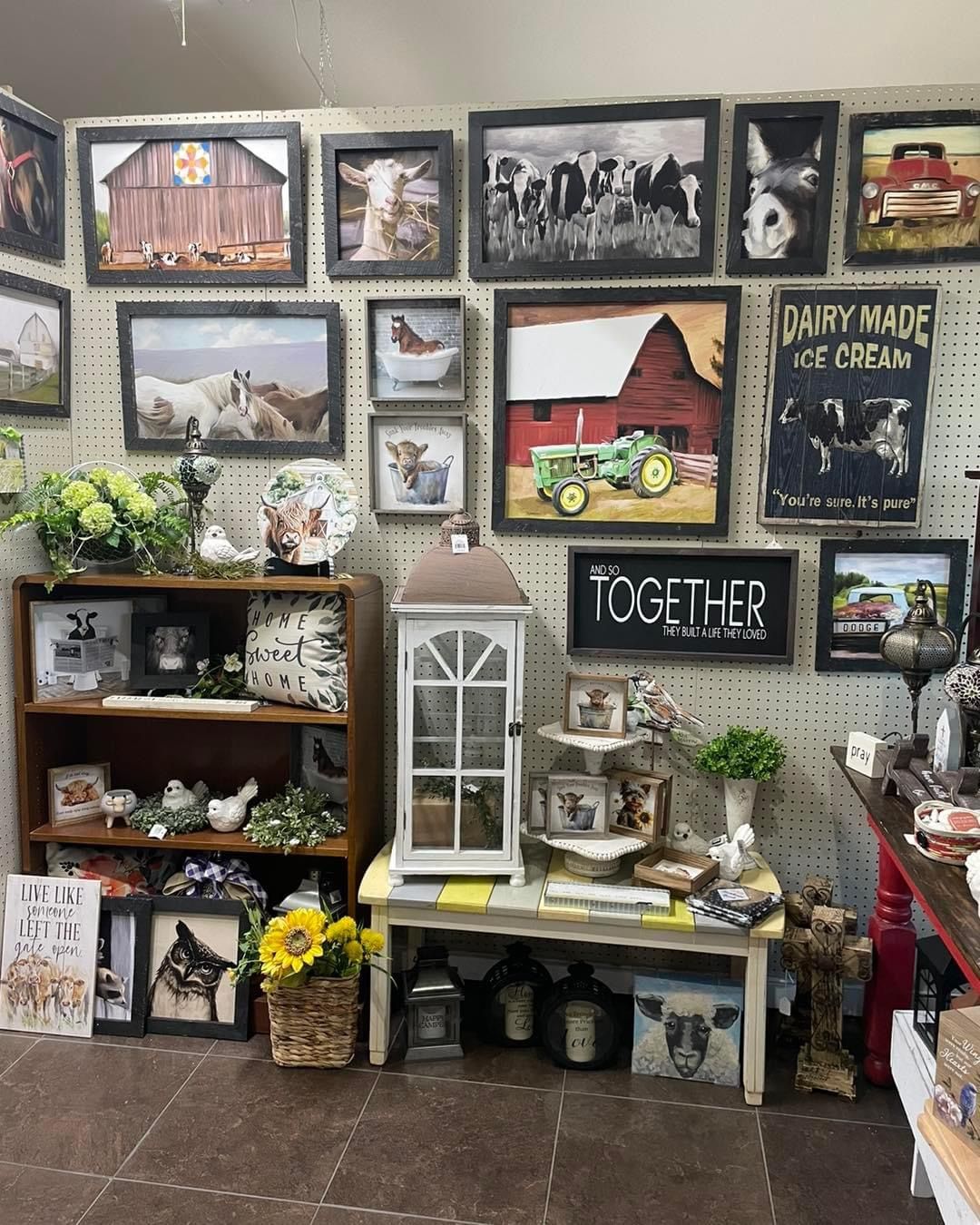 There are a lot of pictures on the wall in this room.