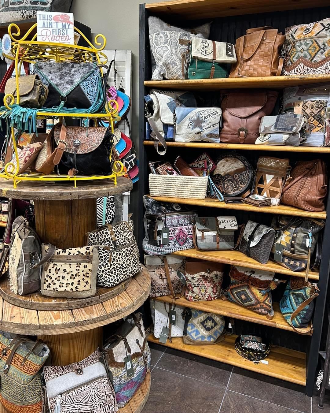 A store filled with lots of handbags on shelves.