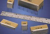 Electronic components and a ruler laid out on a blue background