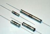 Three small silver cylindrical metal fuses on a white background.