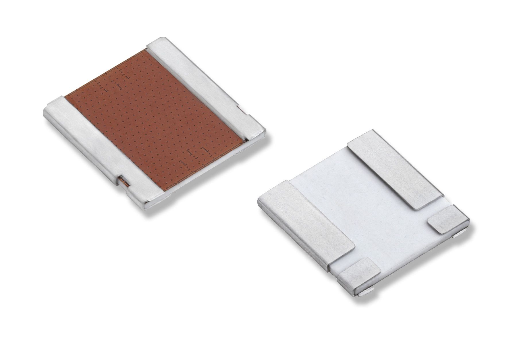 Two small metallic electronic components, one showing a copper-colored center pad