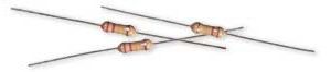 Three axial-lead resistors with tan bodies and color bands on a white background
