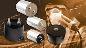 Assorted electrical capacitors and plugs on a circuit board background with warm orange lighting