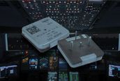 Two white drones hovering over a dim cockpit control panel