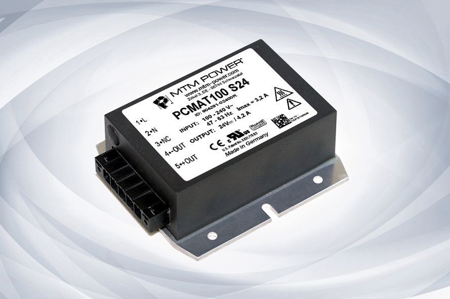 Black rectangular electronic module with connector and metal mounting flange on a light background
