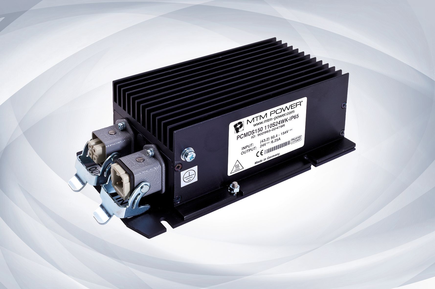 Black finned electrical power module with metal connectors on a white background