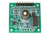 Green circuit board with a small metallic camera module and electronic components