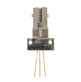 Small silver electronic component with three gold pins and a printed label on a rectangular base