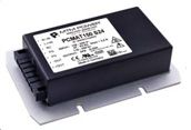Black electronic power module with white label and metal base plate on a gray background
