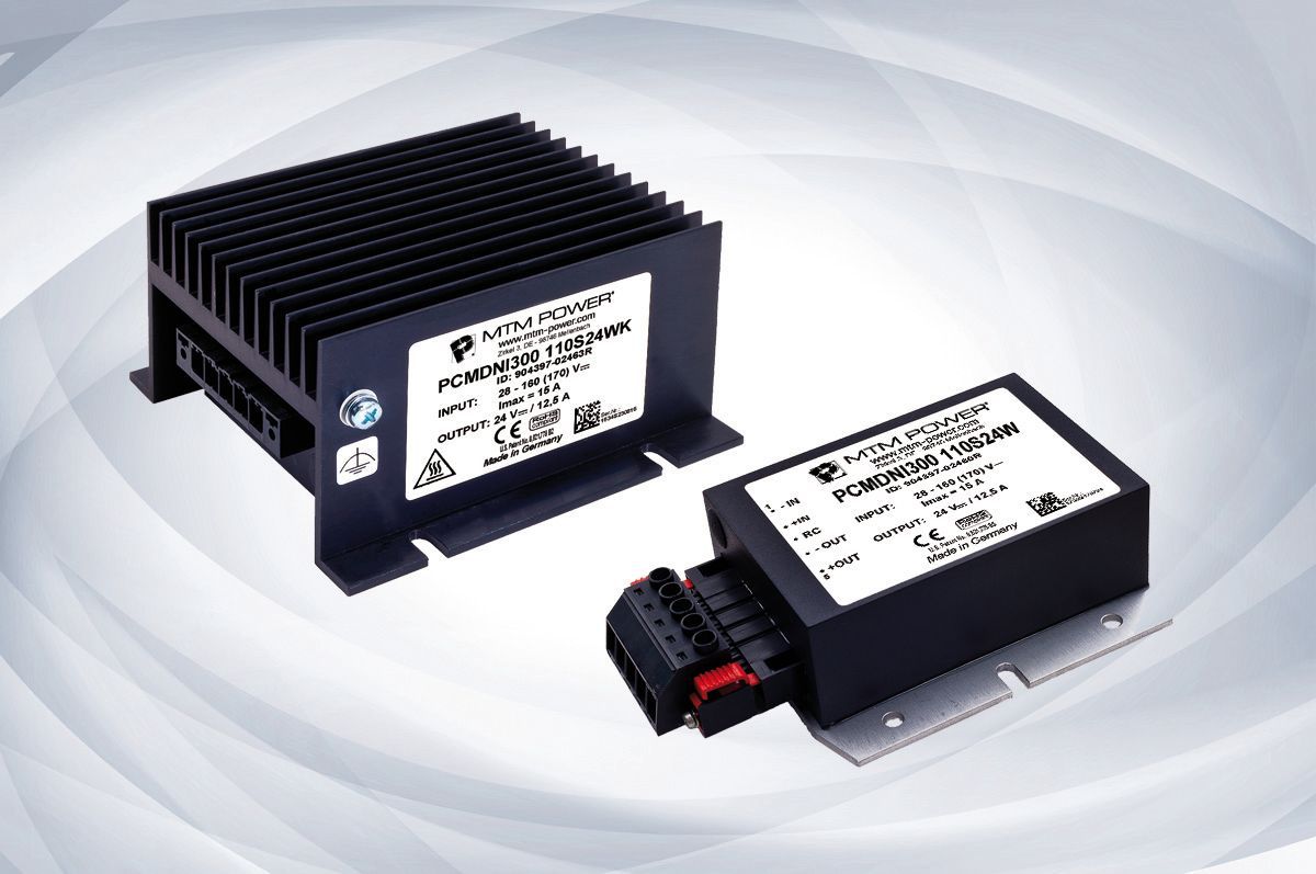 Two black electronic control modules with labels, shown on a light gray background
