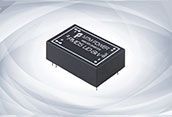 Black electronic component chip with white labeling on a light background