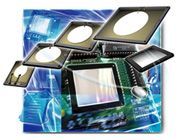 Abstract collage of computer monitors, circuit boards, and blue digital graphics