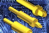 Three yellow screwdrivers on a blue circuit board background