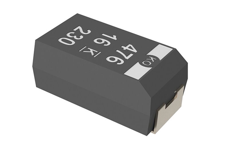 Black electronic component with white markings, shown at an angle on a white background
