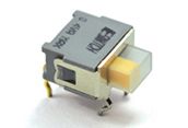 Small silver and black toggle switch with a white actuator on a plain background