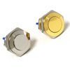 Two round metal push buttons, one silver and one gold, on a white background