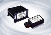 Two black electronic control modules with labels, shown on a white background.