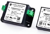 Two small black and white electronic modules with green connector terminals on a white background