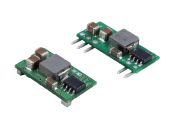 Two small green electronic circuit boards with silver components and pins on a white background