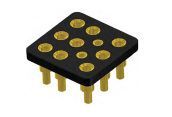 Black electronic component with gold pads and pins, resembling a small integrated circuit package