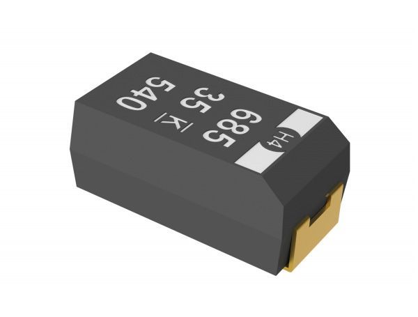 Black electronic capacitor component with white markings on a plain background