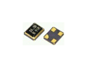 Two black square electronic chips, one showing gold contact pads
