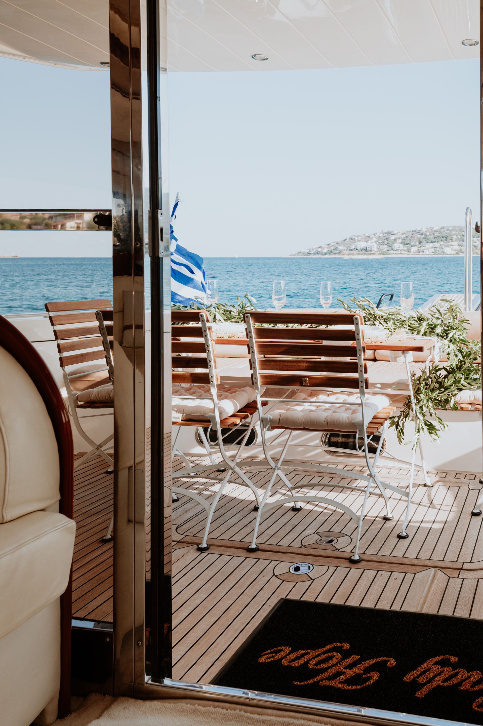 Calm ocean waters surrounding a yacht near shoreline