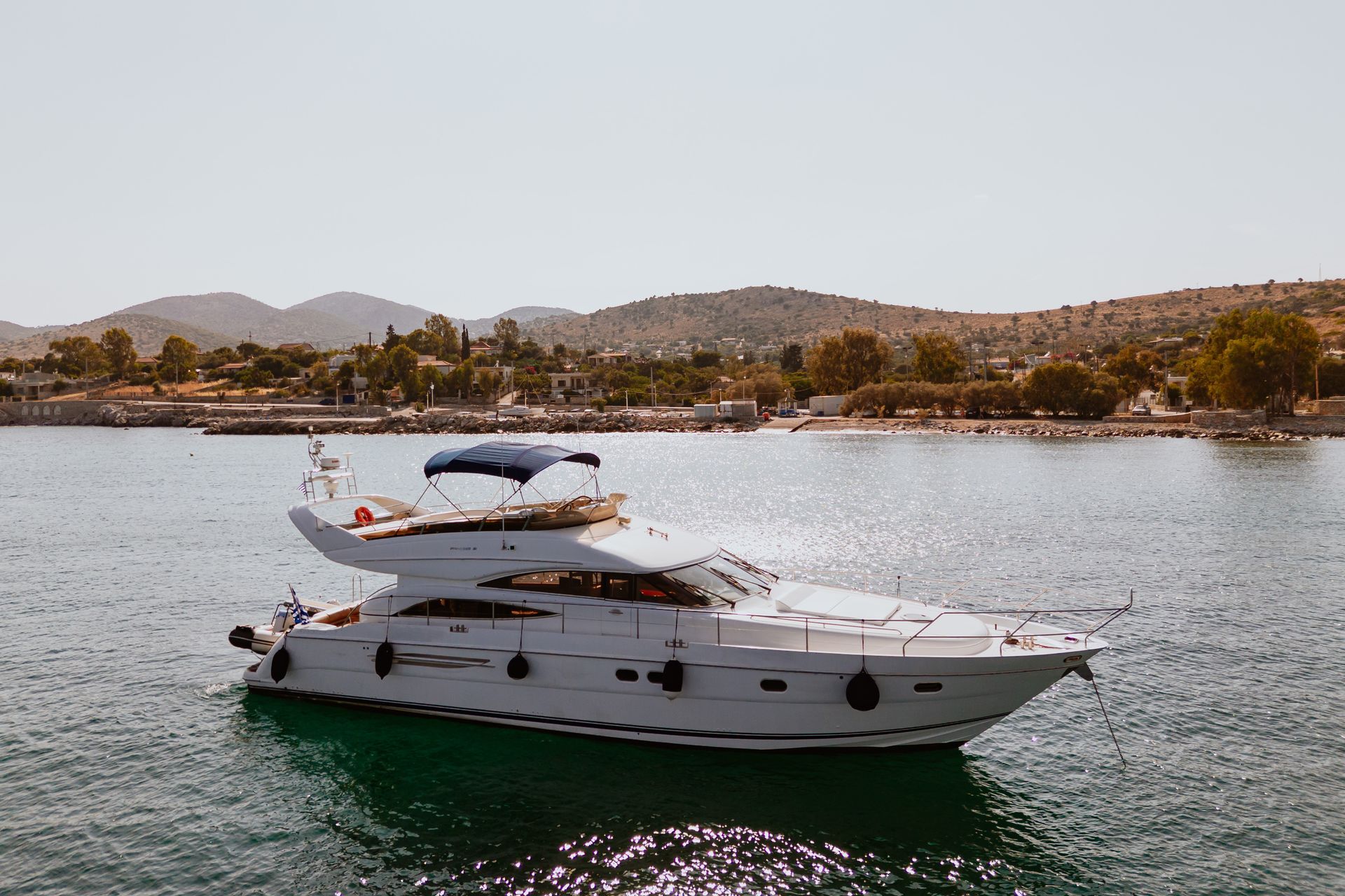 Luxury yacht sailing on calm blue waters
