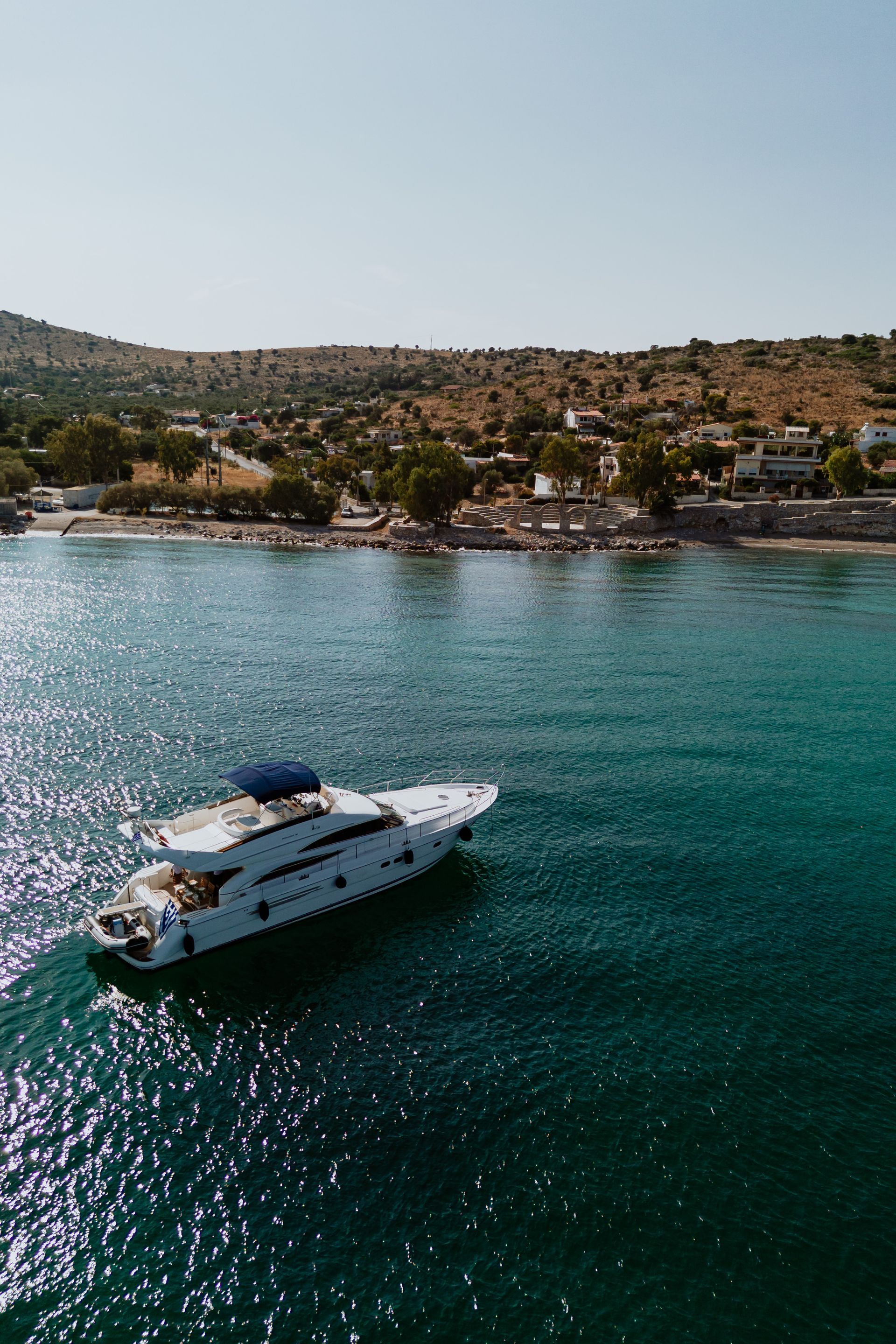 Turquoise waters and rocky coastline from a yacht charter