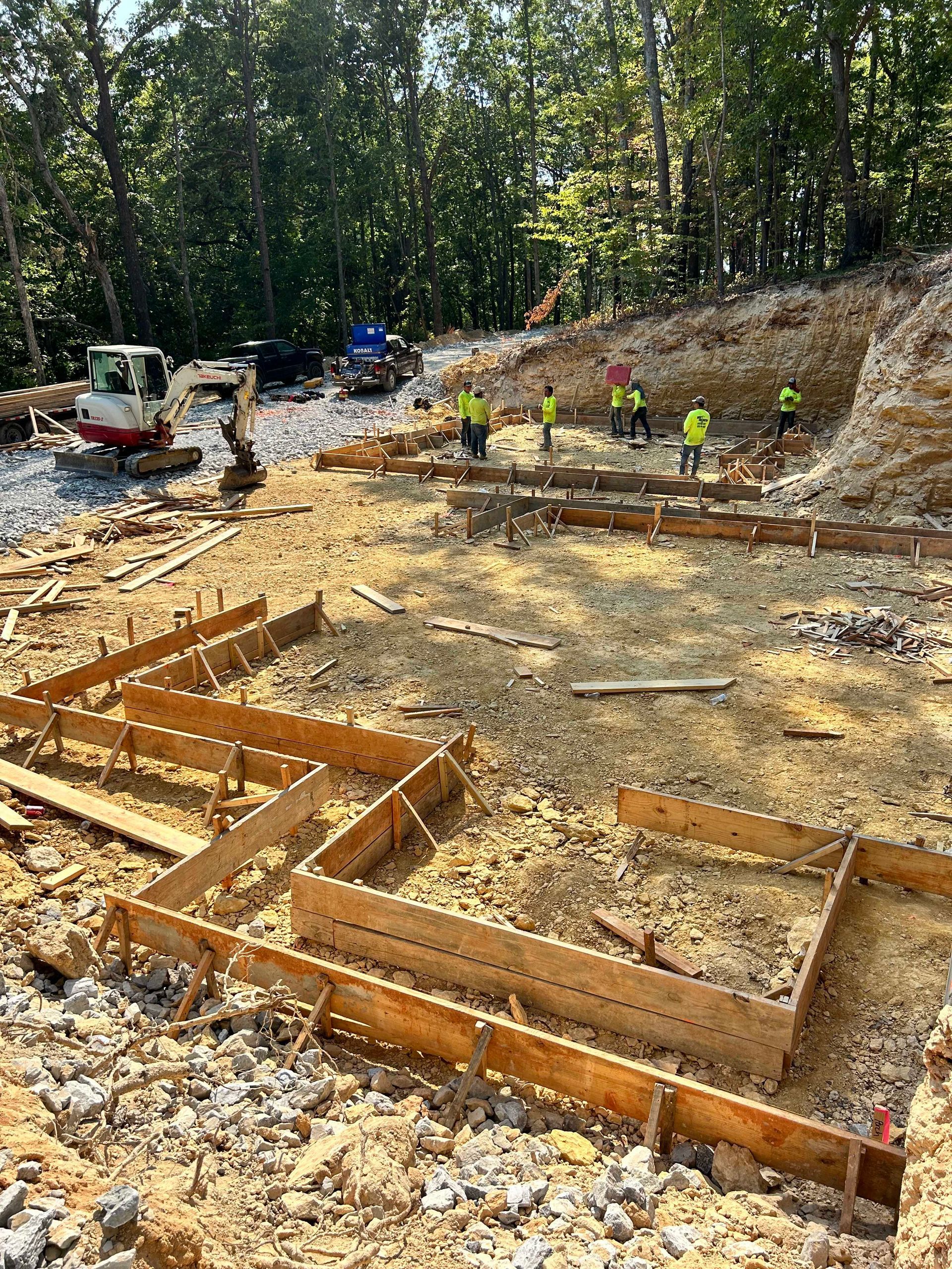 A group of construction workers are working on a construction site.