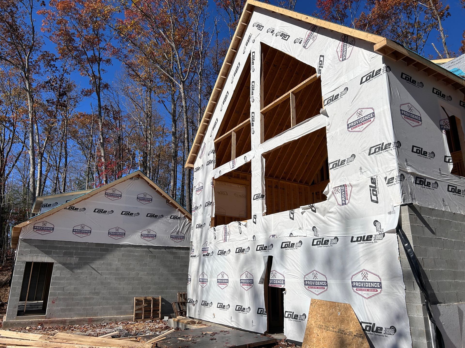 A house is being built in the middle of a forest.