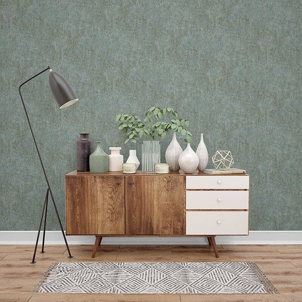 a living room with a wooden dresser filled with vases and a lamp