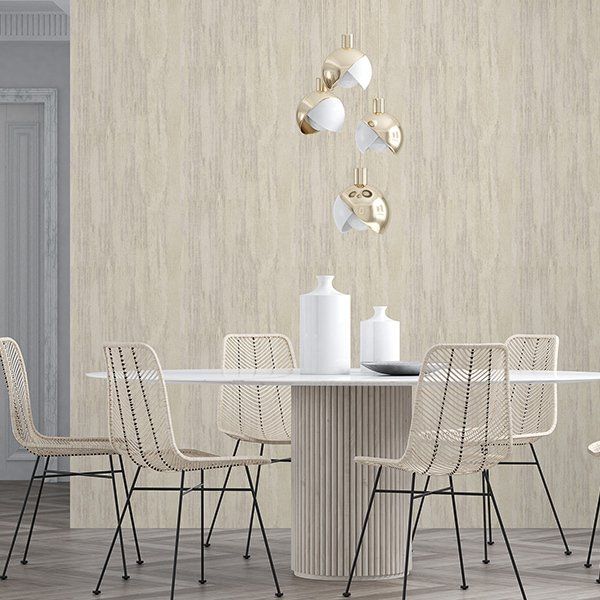there is a table and chairs in the dining room .