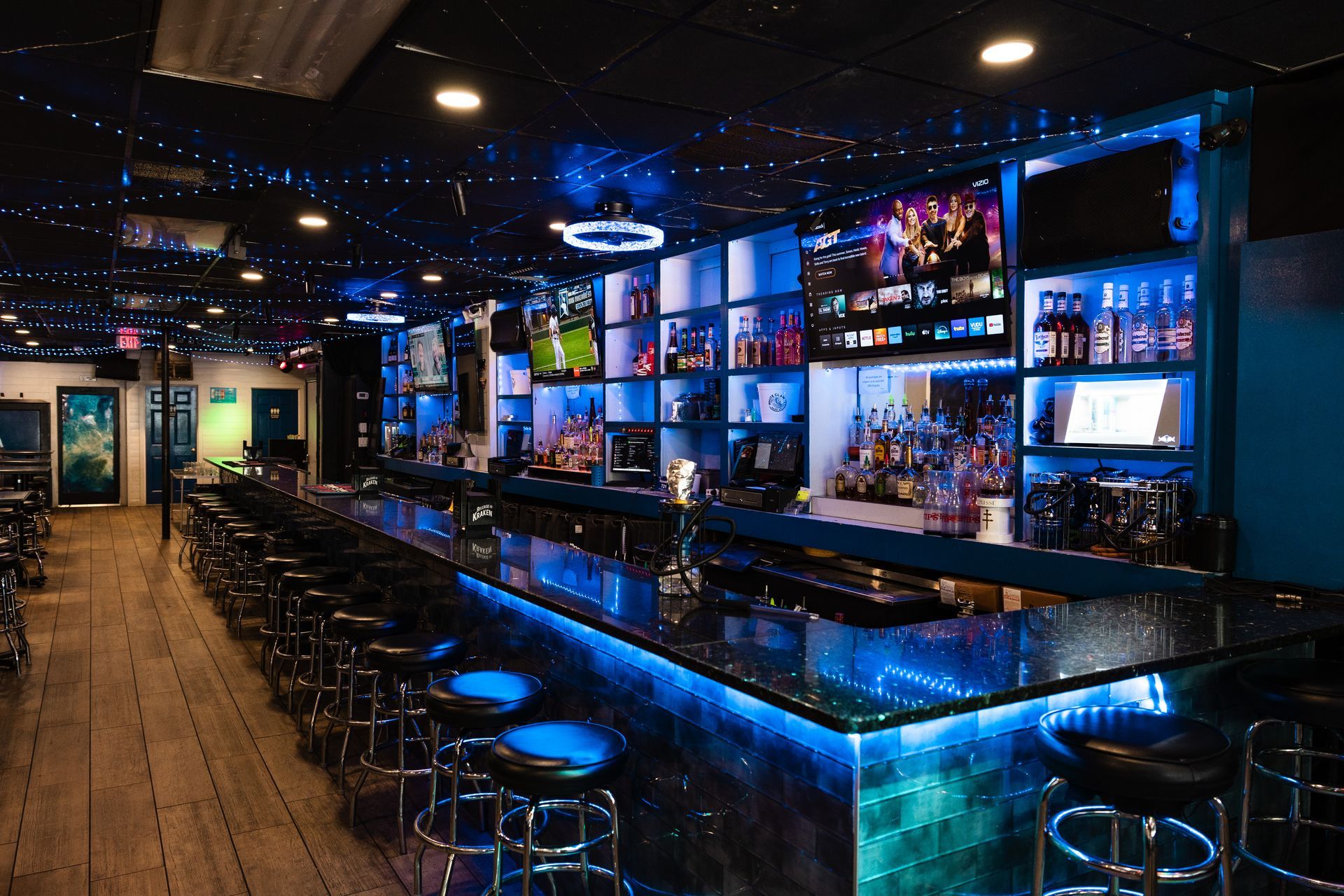 A bar with a lot of blue lights on it