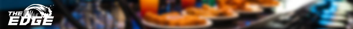 A blurry picture of a colorful background with a building in the background.