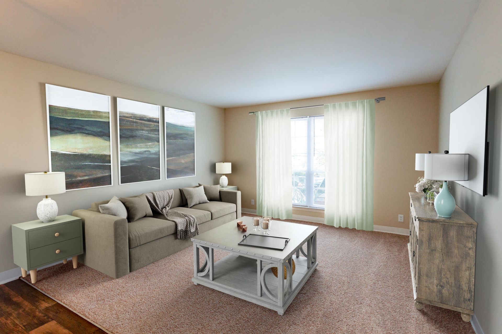 A bright, neutral-toned living room with a sofa, coffee table, two side tables, and landscape art on the wall.