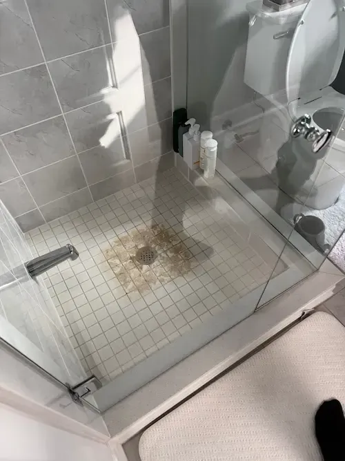 emergency plumber oakville fixing shower drain clog and slow water drainage