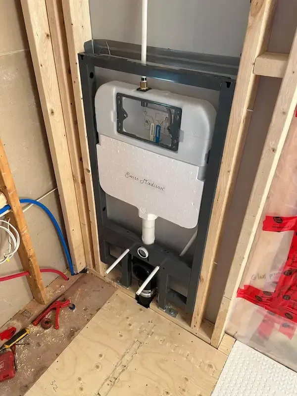 Wall hung toilet installation in Oakville bathroom renovation by professional licensed plumber