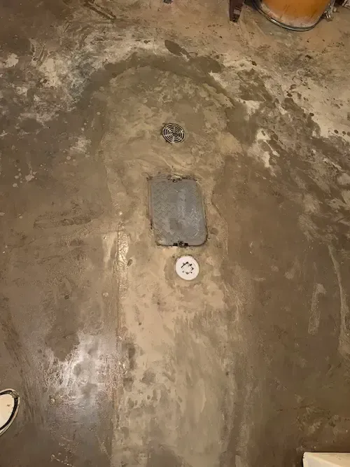 Backwater valve installation in Oakville basement after underground sewer pipe repair