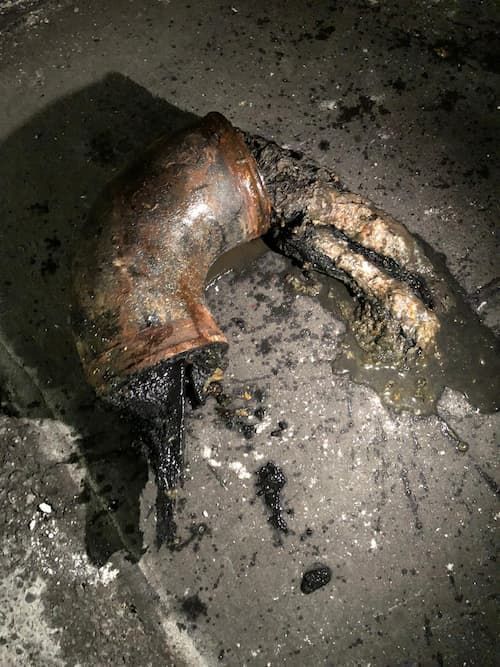 debris stuck in pipe in condominium building