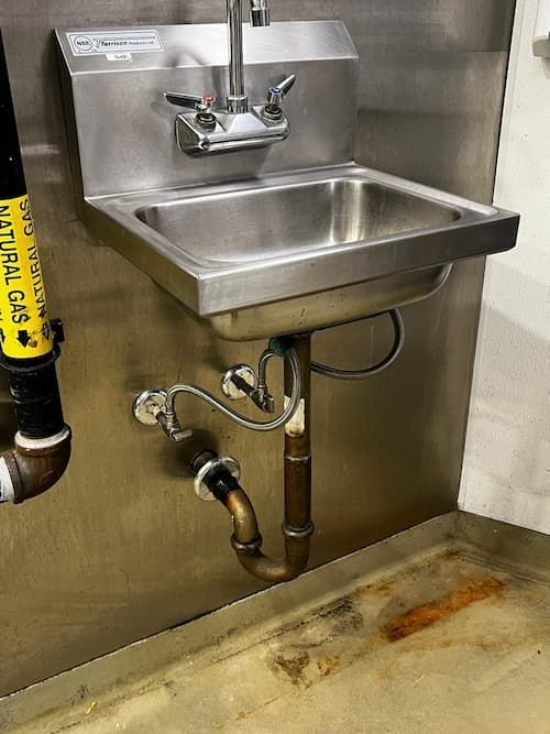 Commercial sink drain Oakville restaurant - rusty pipe